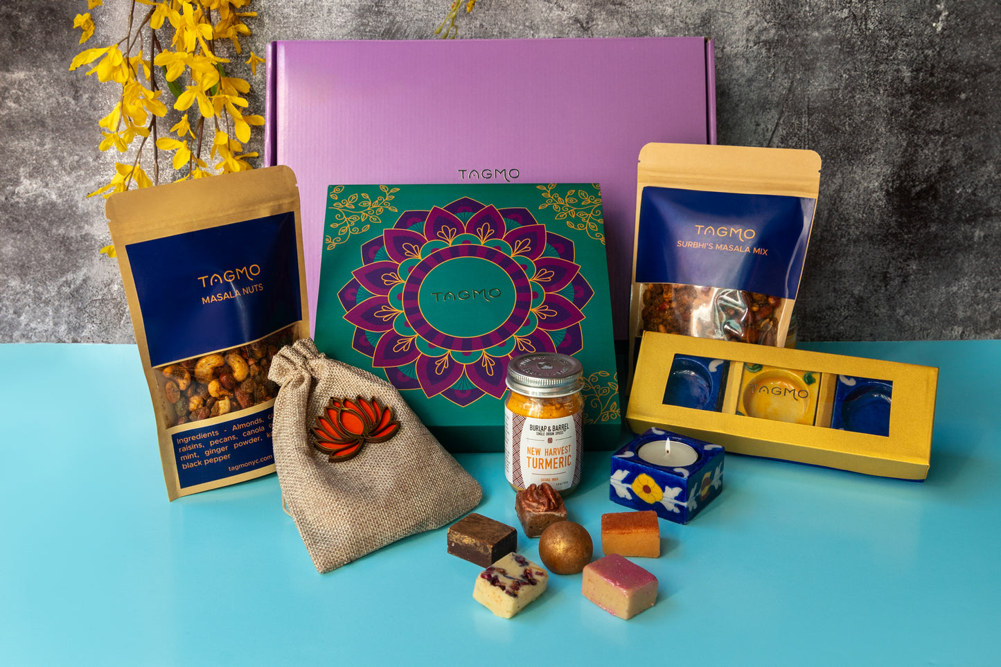 Vibrant Diwali Delight: A festive Indian mithai gift box showcasing a variety of traditional treats, from handcrafted diyas to flavorful kaju katli and masala nuts, capturing the essence of the Diwali celebration.